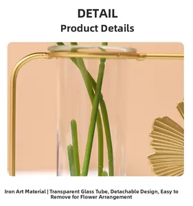 Detail of gold ginkgo leaf iron stand with a clear glass test tube for hydroponic plants