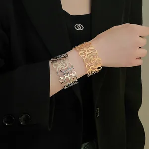 Geometric hollow rose pattern wide metal cuff bracelets in gold and silver finishes