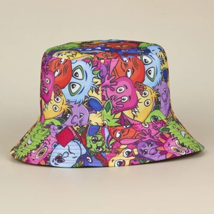 Detail of colorful cartoon monster print on reversible sun hat with premium canvas texture