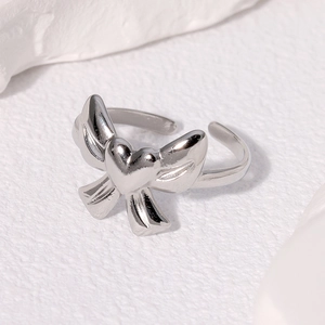 Polished silver stainless steel open ring with unique heart and wing design elements