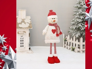 Detail of Christmas snowman plush with telescopic legs and red heart on knit sweater