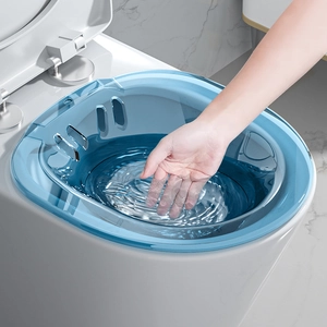 Blue transparent sitz bath basin for postpartum care placed on a standard white toilet