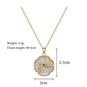 Detail view of gold woodpecker shell necklace with size and weight specifications