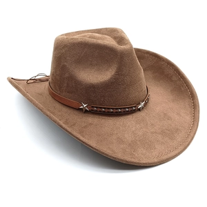 Detailed close-up of brown western cowboy hat featuring metallic stars on leather band