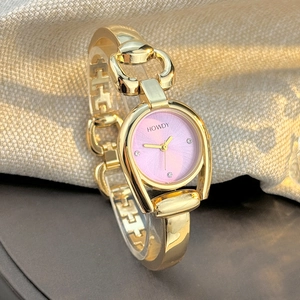 Elegant gold horseshoe watch for women with pink gradient dial and diamond indices