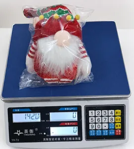 Detailed close-up showing the precise 142g weight of the plush Christmas gnome decoration