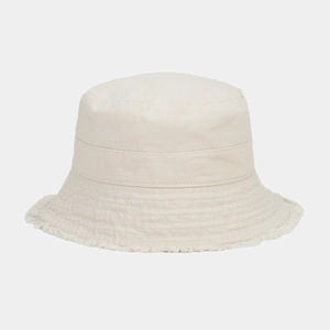 Detail of beige cotton bucket hat featuring frayed fringe edges and premium twill texture