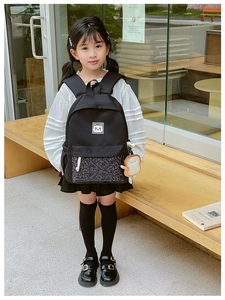 Black school backpack for kids with cat logo and plush toast charm accessory