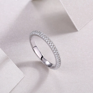 Close-up of S925 hallmark on a minimalist silver moissanite ring with paved zircon details