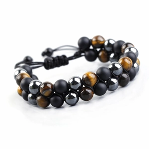 Detail of double-layer beaded bracelet with tiger eye stone and adjustable woven rope
