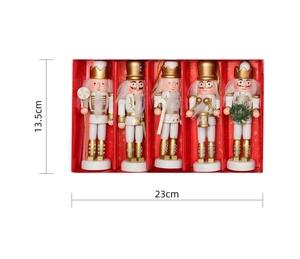 Detailed view of 5-piece set of white and gold wooden nutcracker soldier ornaments