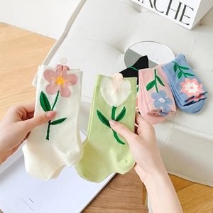 Women's cotton crew socks with 3D tulip and daisy floral knit patterns in soft pastel colors