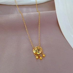 Detail of gold titanium steel longevity lock pendant necklace with Fu character