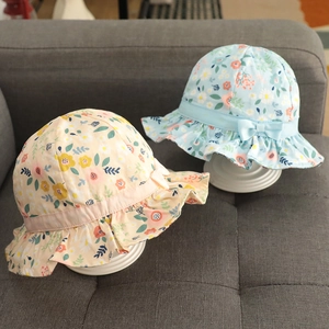 Floral cotton baby sun hat with bow and ruffled brim in beige and light blue colors