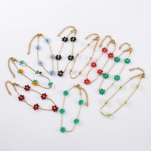 Bohemian beaded flower bracelet set in colorful beads with a golden stainless steel chain