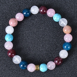 Detailed view of bohemian multicolor natural stone beads bracelet with metal spacer