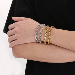 Set of four stainless steel rolo and cable chain bracelets in gold and silver finish