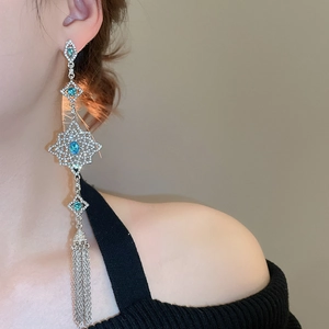 Elegant long silver tassel earrings with sea blue stones and diamond floral hollow design
