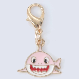 Pink cartoon shark keychain accessory in polished gold metal with lobster clasp