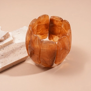 Close-up of amber marble acrylic rectangular linked bracelet with elastic stretch