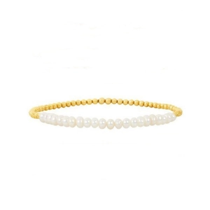Detailed close-up of Baroque freshwater pearls and 18K gold beads on elastic bracelet