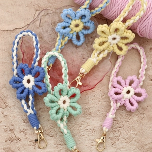Handmade woven floral wrist lanyards in various colors with golden metal clasps