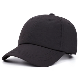 Classic solid black baseball cap with six-panel structure and curved brim for sun protection