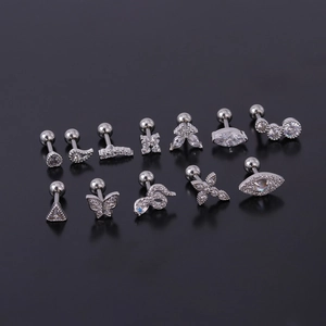 Set of 12 stainless steel stud earrings with butterfly, snake, and evil eye designs