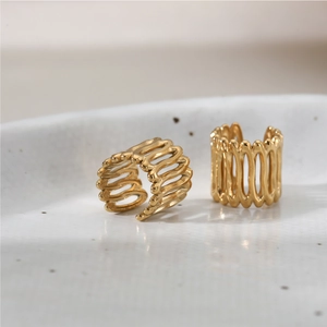 Minimalist gold-plated stainless steel ear cuffs featuring hollowed wavy stripe texture