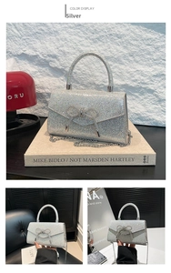 Silver glitter evening bag with rhinestone bow and metal chain strap detail