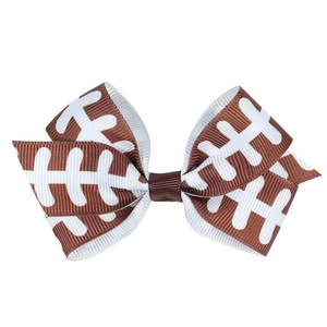 Detail of brown ribbon hair bow with white football pattern and durable metal duckbill clip