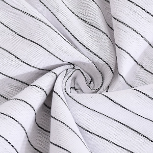Macro shot of striped fabric with detailed textile texture and black and white pattern