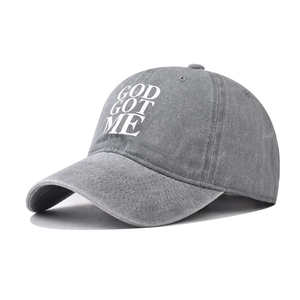 Washed dark grey cotton baseball cap with white God Got Me text in a vintage street style