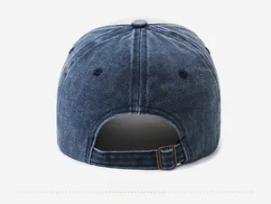 Rear view of washed denim baseball cap featuring adjustable bronze metal buckle