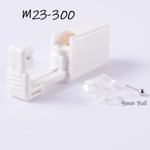 Detail view of disposable sterile ear piercing tool with a 3mm silver ball stud