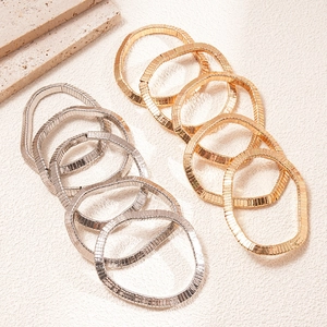 Minimalist metallic geometric snake bone bracelets in layered gold and silver finish