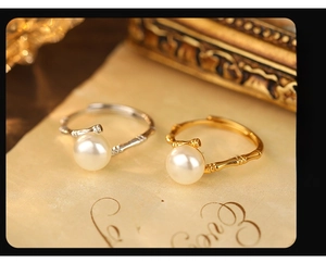Detailed view of S925 silver bamboo joints rings with lustrous pearls in gold and silver