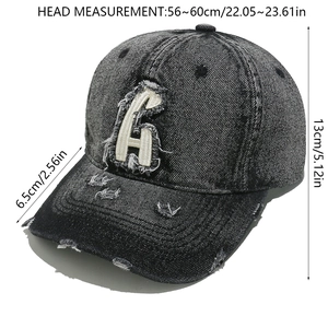 Detail showing distressed grey washed denim baseball cap with letter G embroidery