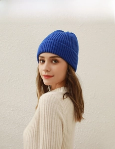 Close-up of klein blue ribbed knit beanie with stylish folded cuff for winter warmth