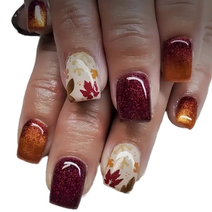 Autumn maple leaf press-on nails with red glitter and orange gradient designs