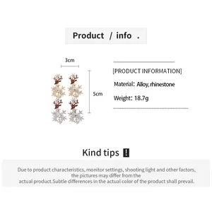Detail view of rhinestone deer and snowflake earrings with dimensions 3cm width and 5cm height