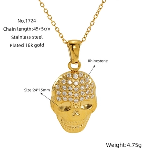 Detail of 18k gold plated skull pendant with rhinestones and size specifications