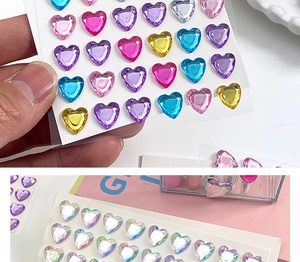 Detailed view of colorful 3D crystal heart stickers for kids in pink and blue shades