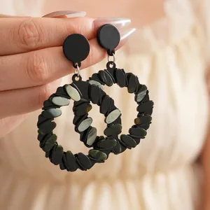 Minimalist geometric hoop earrings with green marble inlays and black finish style