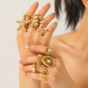 Vintage gold starfish shell and pearl ring set for women in elegant stacked style