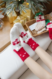 Close-up of thick coral fleece Christmas socks with cute bear ears and non-slip sole