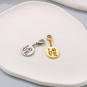 Golden and silver stainless steel heart pendants with lobster clasp and paw print engraving