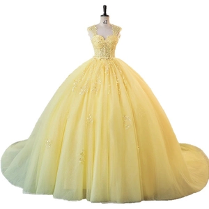Elegant bright yellow evening gown with floral embroidery and layered tulle puff skirt