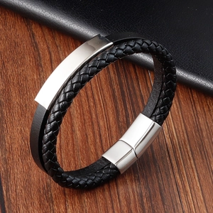 Detail of men's double-layer black braided leather bracelet with magnetic steel clasp