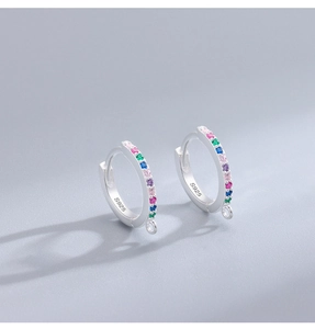 Detail of S925 sterling silver hoop earrings with multicolored zircon stones and a small loop